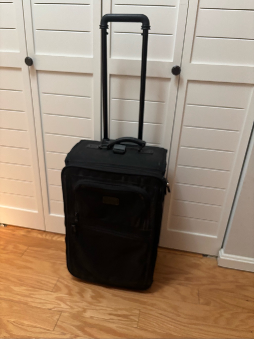 Tumi Black Rolling Carry-On With Telescoping Handle